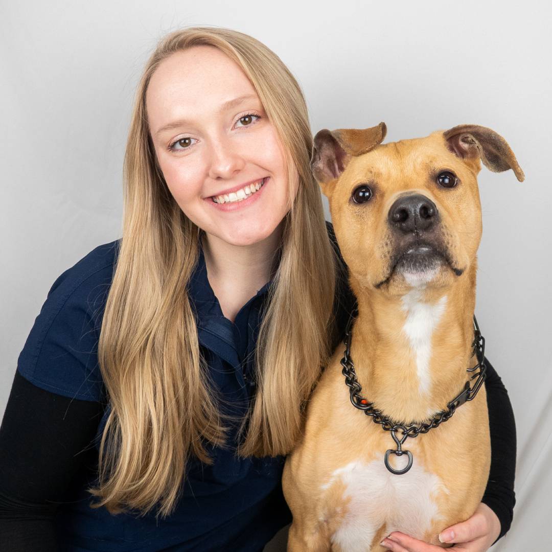 Cara and dog smiling