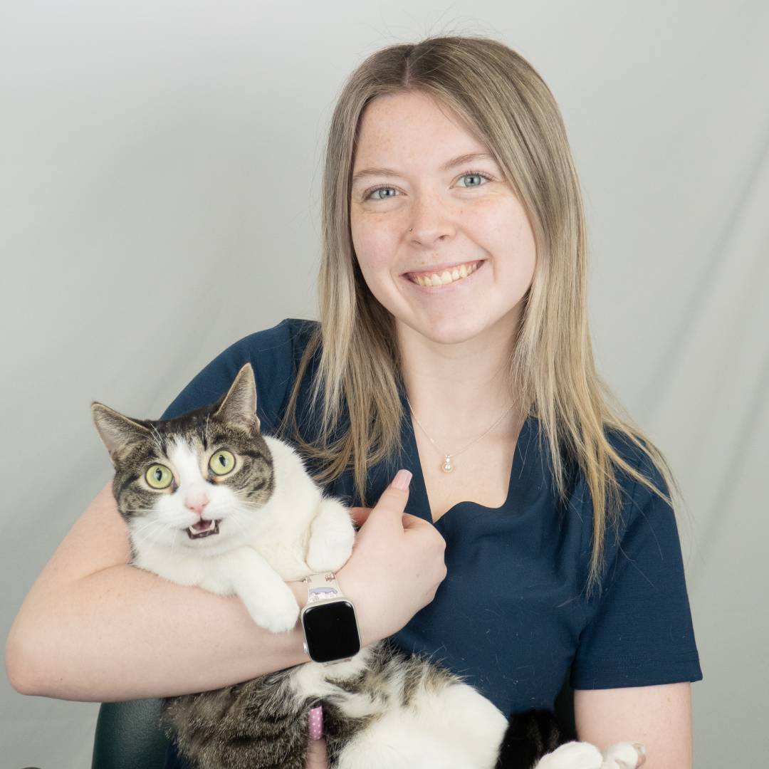 Madysen holding surprised cat