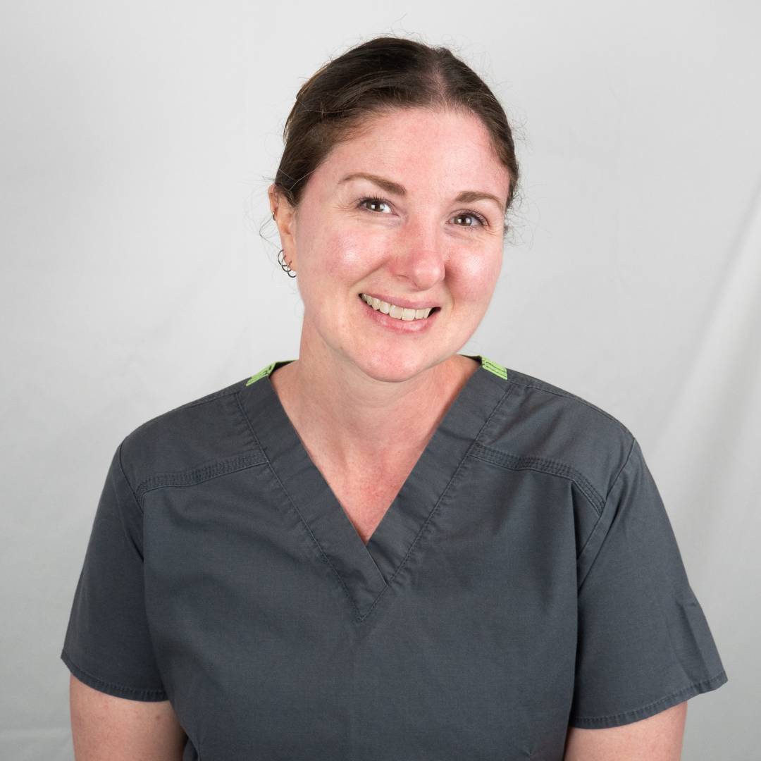 Sarah C. in scrubs smiling