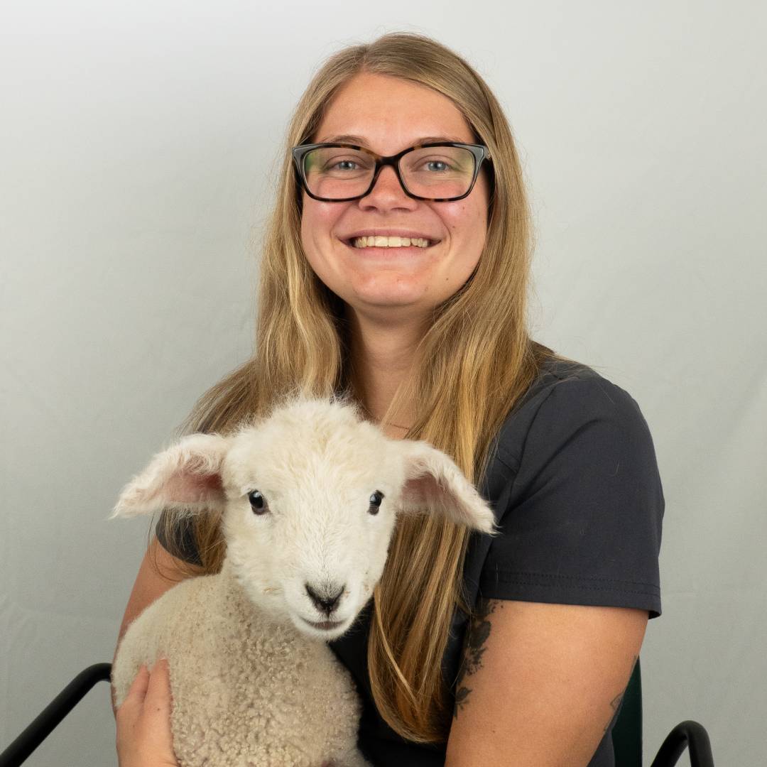 Terra with lamb, smiling