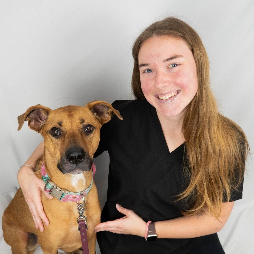Woman and dog smiling